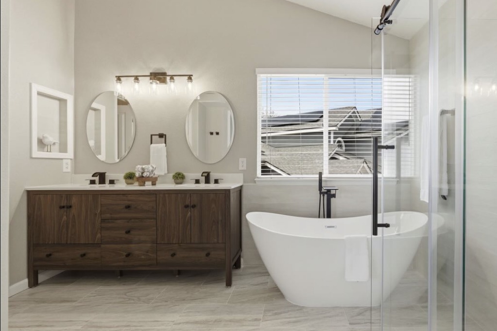 Primary bathroom with a freestanding tub and double vanity