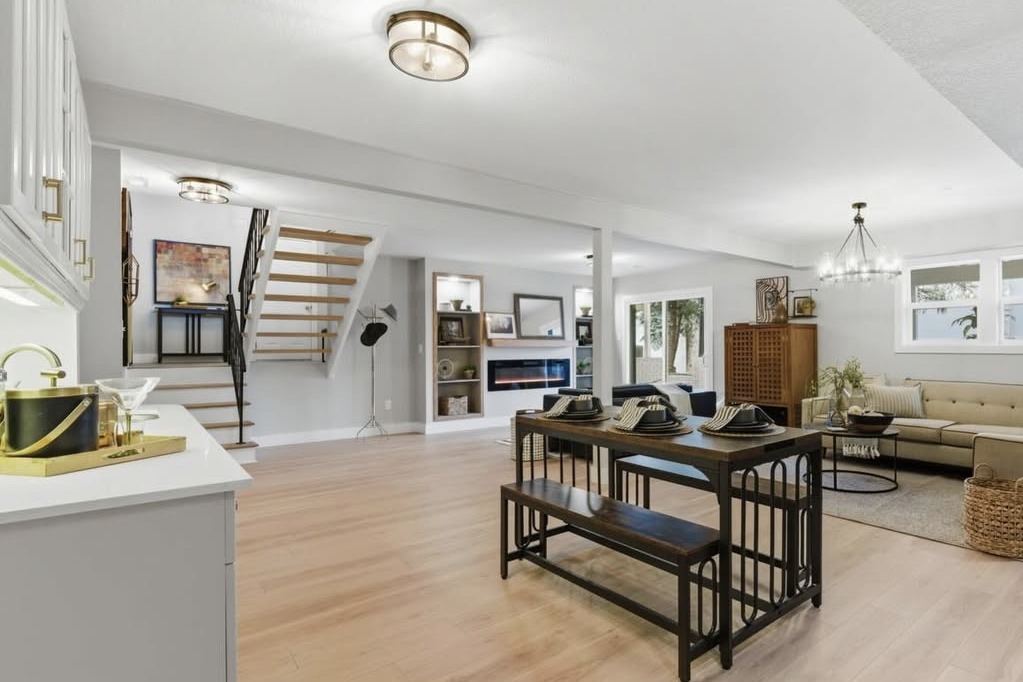 Open living and dining area with a staircase