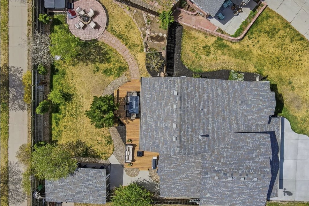 Top-down drone photo of a home and backyard