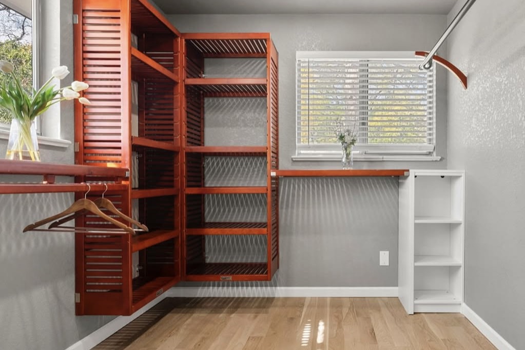 Walk-in closet with wood shelving