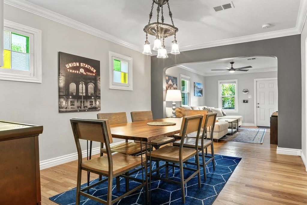 Dining room with a chandelier and stained glass windows